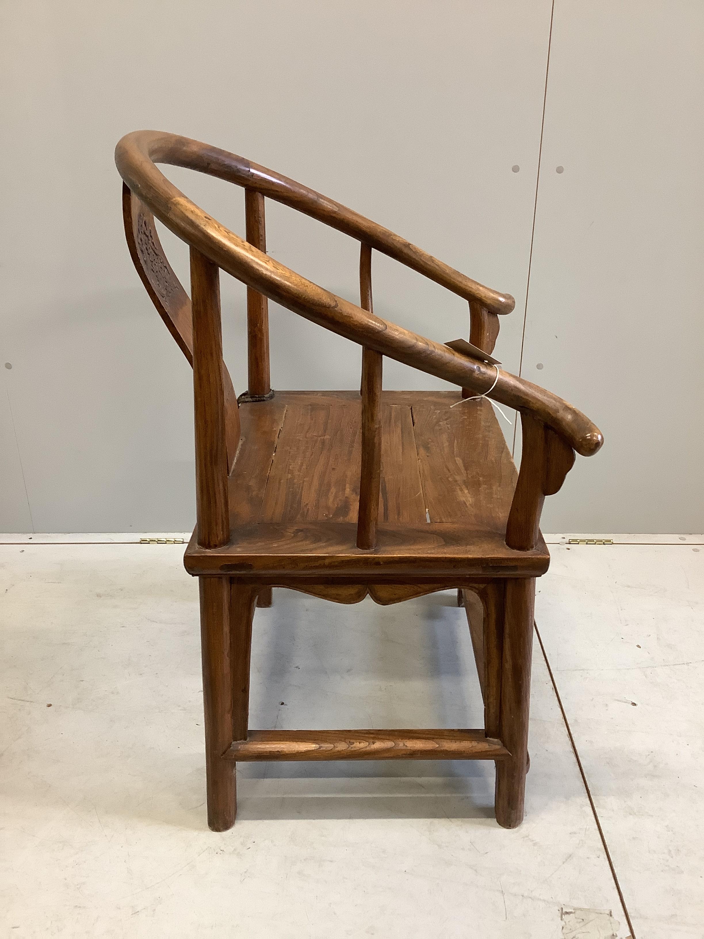 A Chinese elm chair, width 70cm, depth 54cm, height 101cm